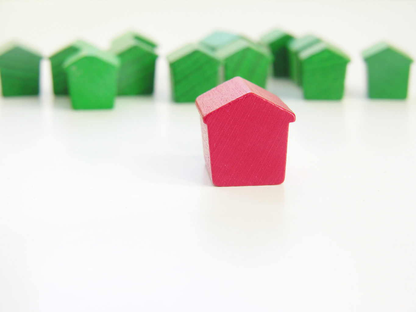 Search for homes in St. Louis - one red house among green houses